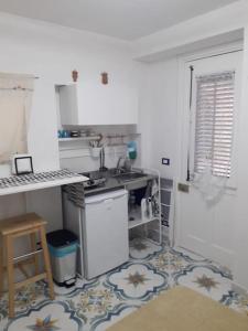 Kuchyň nebo kuchyňský kout v ubytování Oneto Apartment