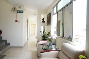 a living room with a couch and a glass table at Trang An Hotel - 10 minutes Landmark 81 in Ho Chi Minh City +79 photos