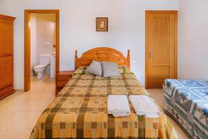 Postel nebo postele na pokoji v ubytování Casa Xaupí Gran + 11 fotografií