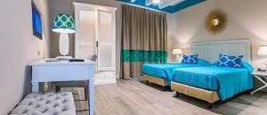 Posteľ alebo postele v izbe v ubytovaní Hotel San Michele
