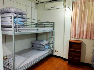Letto o letti in una camera di Ku Shan Yuan Hotel