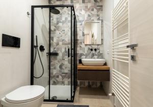 a bathroom with a shower and a toilet and a sink at SAN BARTOLOMEO BAROQUE in Scicli +28 photos