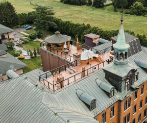an aerial view of a building with a tower at Hotel Montfort Nicolet in Nicolet