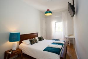 Cama ou camas em um quarto em VisHostel