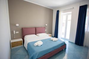 Postel nebo postele na pokoji v ubytování Hotel da Alfredo