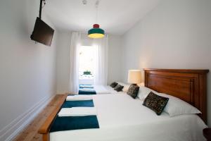 Cama ou camas em um quarto em VisHostel
