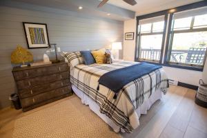 a bedroom with a bed with a dresser and a window at 1303 - Two Bedroom Deluxe Eagle Springs West condo in Solitude