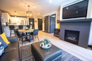 a living room with a couch and a fireplace at 1303 - Two Bedroom Deluxe Eagle Springs West condo in Solitude