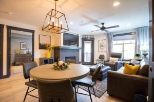 a living room with a table and a couch at 1303 - Two Bedroom Deluxe Eagle Springs West condo in Solitude