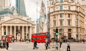 a red double decker bus on a busy city street at Hidden gem in Central London Oval - Elephant and Castle in London