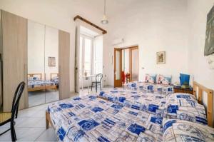 a large bedroom with a large bed in a room at Il Soffione Centro Storico in Salerno