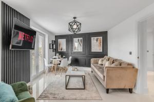 a living room with a couch and a table at Modern Apartment in Wymondham in Wymondham