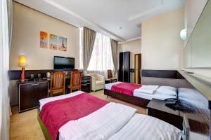 Posteľ alebo postele v izbe v ubytovaní Terra Nova Sport&Spa Hotel