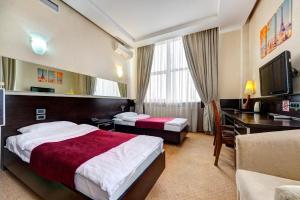 Posteľ alebo postele v izbe v ubytovaní Terra Nova Sport&Spa Hotel