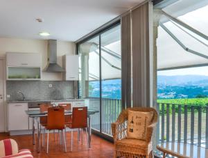 a kitchen and dining room with a table and chairs at Braga House & Wine in Braga