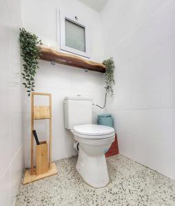 a bathroom with a toilet and a window at בית בלב הגולן in Qasrîne