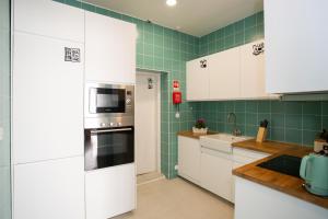 A cozinha ou cozinha compacta de VisHostel