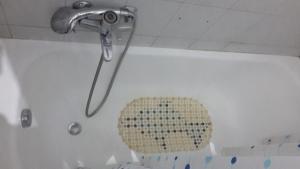 a shower head in a bathroom with a tub at Copertino da Amare in Copertino +1 photo
