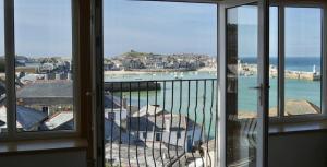 a view of the ocean from a balcony at Harbour View House in St Ives