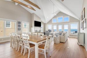 a dining room with a table and chairs at Middlesex Beach -- 30 Dune in South Bethany