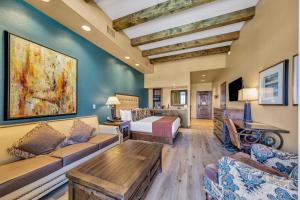 a living room with a couch and a table at The Murieta Inn and Spa in Rancho Murieta