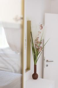 Postel nebo postele na pokoji v ubytování Apartman Stari Toranj III