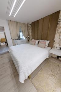 Postel nebo postele na pokoji v ubytování Apartman Stari Toranj III