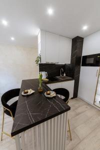 Kuchyň nebo kuchyňský kout v ubytování Apartman Stari Toranj III