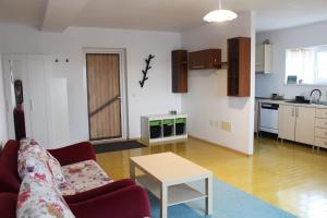 a living room with a couch and a table at M K L Studio in Alba Iulia