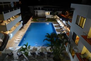 an overhead view of a swimming pool in a building at Casablanca Hotel in San Ramón