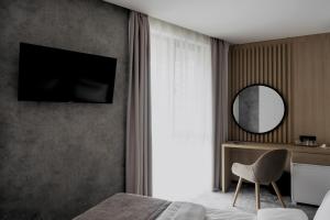 TV a/nebo společenská místnost v ubytování Boutique Macchiato Rooms