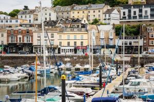 a bunch of boats are docked in a harbor at Blue Skies Apartment - Harbour Views in Torquay