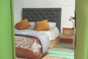 Postel nebo postele na pokoji v ubytování La Liebre bed and breakfast