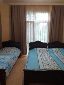 Postel nebo postele na pokoji v ubytování Family Hotel "Big House"