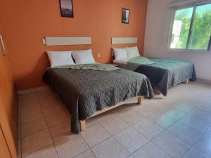 Postel nebo postele na pokoji v ubytování Residencia Ximatario