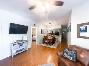 a living room with a couch and a dining room at Our Happy Place in New Braunfels