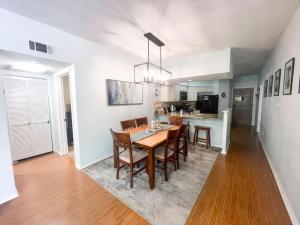 a dining room and kitchen with a table and chairs at Our Happy Place in New Braunfels