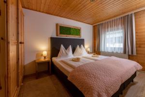 Postel nebo postele na pokoji v ubytování Das kleine Bio Hotel Tiefenbach