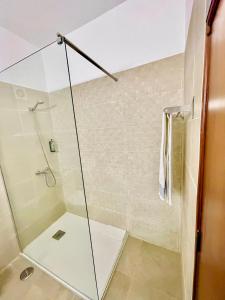 a shower with a glass door in a bathroom at Monte Verde in Funchal