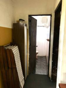 an open door to a bathroom with a toilet at La Cabaña Celeste in Cuchilla Alta