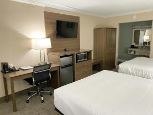 Ένα ή περισσότερα κρεβάτια σε δωμάτιο στο Roadstar Hotel Zephyrhills