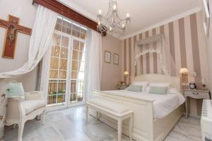 Postel nebo postele na pokoji v ubytování Casa Palacio Argüeso (con garaje, climalit y A/A)