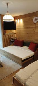 Posteľ alebo postele v izbe v ubytovaní Alpenappartements Domicil include Jokercard