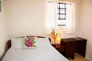 Katil atau katil-katil dalam bilik di Morne SeaView Apartments