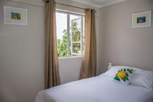 Katil atau katil-katil dalam bilik di Morne SeaView Apartments