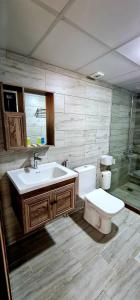 a bathroom with a sink and a toilet at Hasan Zawaideh luxury camp 2 in Wadi Rum