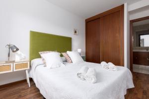 Posteľ alebo postele v izbe v ubytovaní FTV Holidays Homes