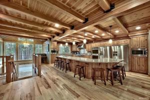 a large kitchen with a large island with bar stools at Skier's Dream! Mansion Right Next to Heavenly in South Lake Tahoe