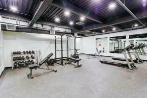 a gym with several exercise equipment in a room at Bringham's Mill Apartments Perfect for Groups Full Kitchen Gym and Free Parking in Rexburg