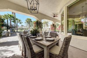 a dining room with a table and chairs at Escape to Legends - Pool, Games & Amazing Mountain Views in PGA West #067651 5br in La Quinta